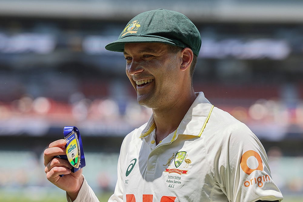 | Photo: AP/James Elsby : Australias Alex Carey poses with man of the match award after Australia won the third Ashes Test against England in Adelaide, Australia.