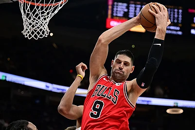 | Photo: AP/David Dermer : Chicago Bulls center Nikola Vucevic rebounds in the second half of an NBA basketball game against the Cleveland Cavaliers in Cleveland.