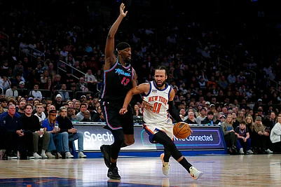 | Photo: AP/John Munson : New York Knicks guard Jalen Brunson (11) dribbles around Miami Heat center Bam Adubayo (13) during the first half of an NBA basketball game in New York.
