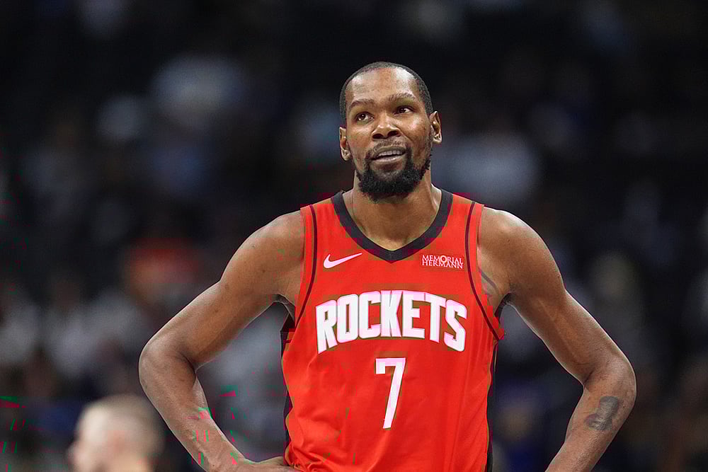 | Photo: AP/David Zalubowski : Houston Rockets forward Kevin Durant heads to the bench late in an NBA basketball game against the Denver Nuggets in Denver. 
