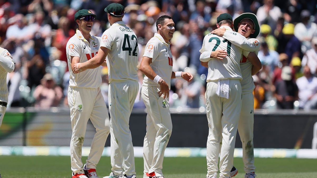 | Photo: AP/James Elsby : Australias players celebrate after winning the third Ashes Test against England in Adelaide, Australia, Sunday, Dec. 21, 2025. 