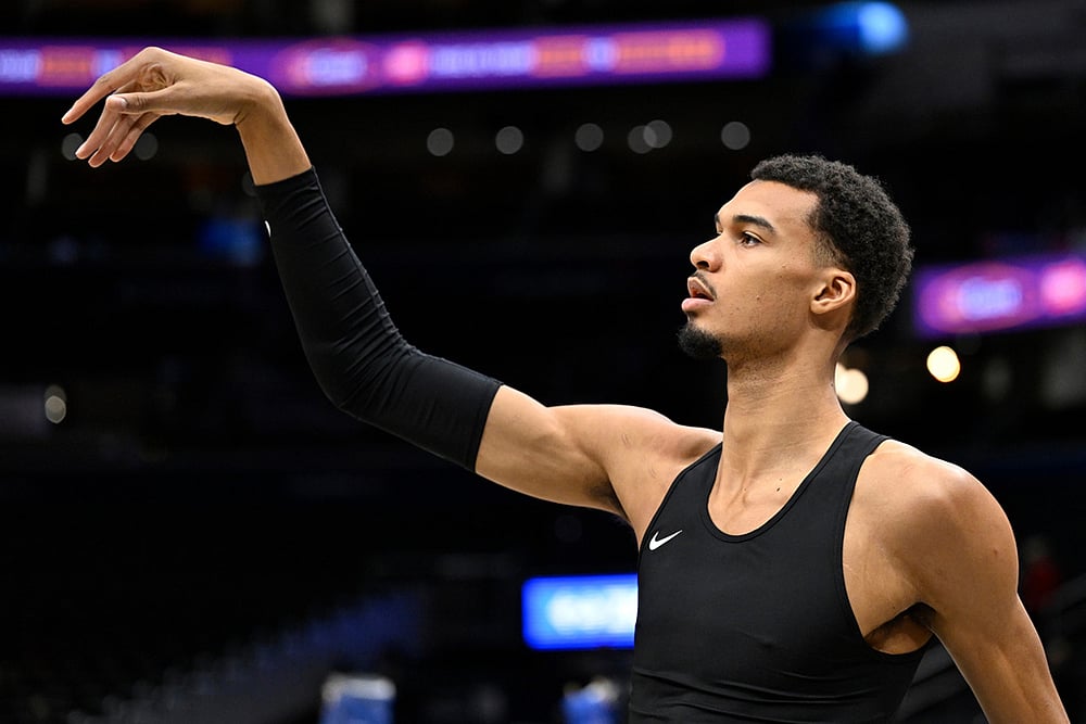 | Photo: AP/John McDonnell : San Antonio Spurs forward Victor Wembanyama warms up before an NBA basketball game against the Washington Wizards in Washington. 