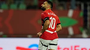 | Photo: AP/Mosa'ab Elshamy : Egypt's Mohamed Salah celebrates after scoring during the Africa Cup of Nations group B soccer match between Egypt and Zimbabwe in Agadir, Morocco, Monday, Dec. 22, 2025.