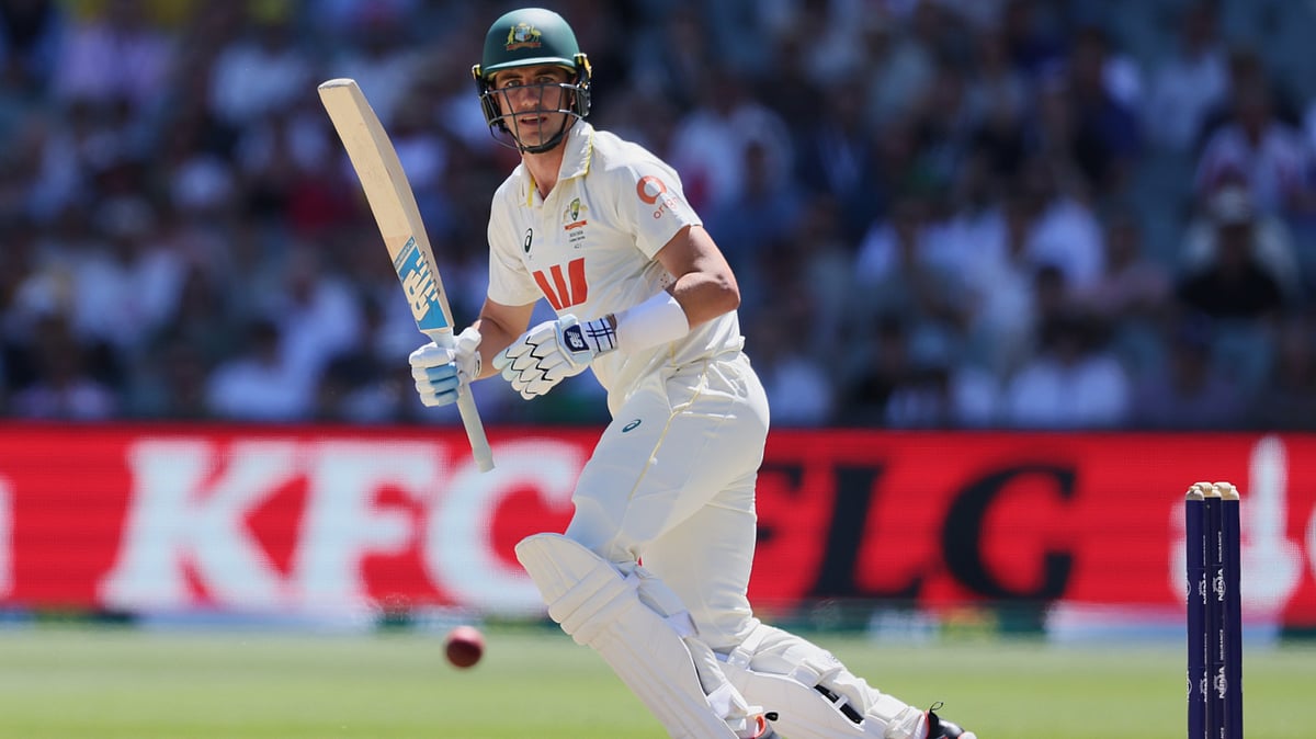 | Photo: AP/James Elsby : Australias Pat Cummins bats during play on day four of the third Ashes cricket test between England and Australia in Adelaide, Australia, Saturday, Dec. 20, 2025. 