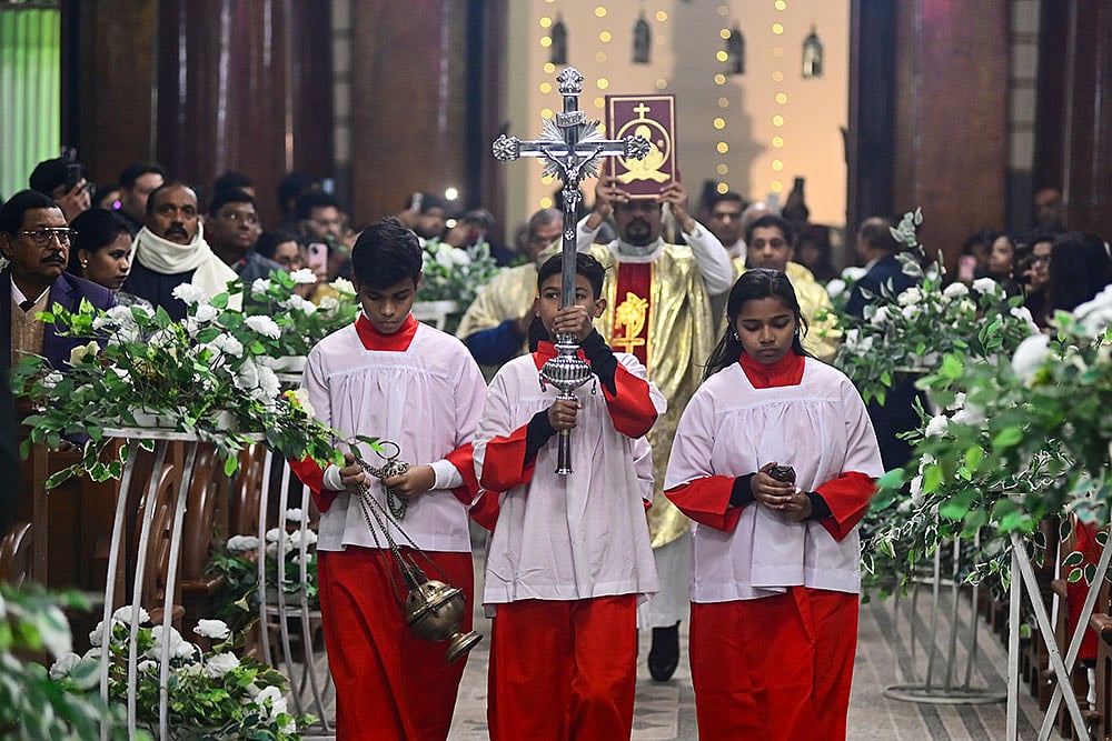 Photo: PTI : Prayagraj: People from the Christian community during the Christmas midnight mass at St. Josephs Cathedral, in Prayagraj, Wednesday night, Dec. 24, 2025. (PTI Photo)(PTI12_25_2025_000019B)