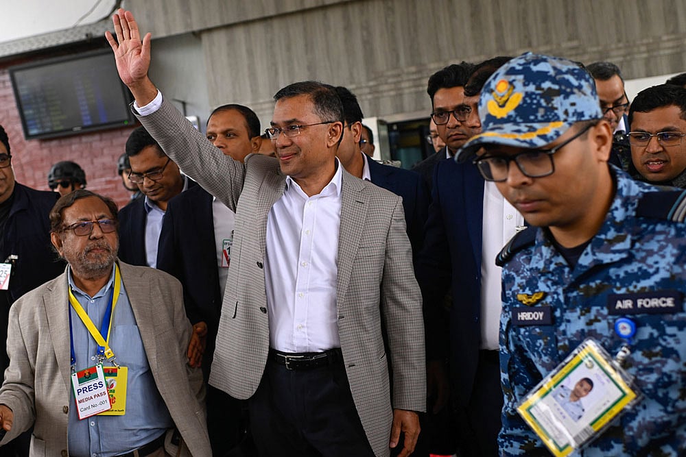 Photo: AP/Mahmud Hossain Opu : Bangladesh Nationalist Party (BNP) Acting Chairman, Tarique Rahman, waves to supporters at Hazrat Shahjalal International Airport in Dhaka after returning from London, ending more than 17 years of self-imposed exile.