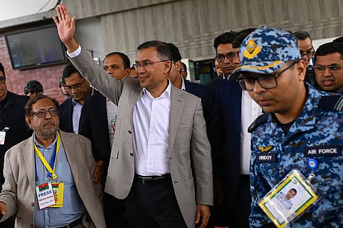 Photo: AP/Mahmud Hossain Opu : Bangladesh Nationalist Party (BNP) Acting Chairman, Tarique Rahman, waves to supporters at Hazrat Shahjalal International Airport in Dhaka after returning from London, ending more than 17 years of self-imposed exile.