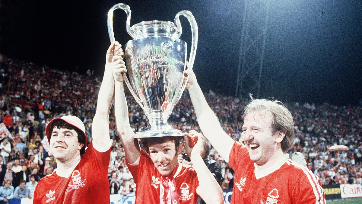 (AP Photo, File) : Nottingham Forest's John Robertson, left, Ian Bowyer, center, and Kenny Burns, right, carry the European Cup in triumph after their 1-0 win against Malmo FF in Munich, Germany, May 30, 1979. 