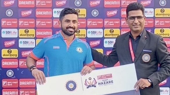 | Photo: X/BCCI Domestic : File photo of Karun Nair winning the Player of the Match award in a Vijay Hazare Trophy game.