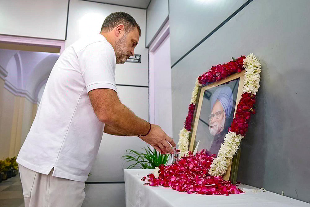 | Photo: AICC via PTI : LoP in the Lok Sabha and Congress leader Rahul Gandhi pays tribute to former prime minister Manmohan Singh on his first death anniversary, in New Delhi. 