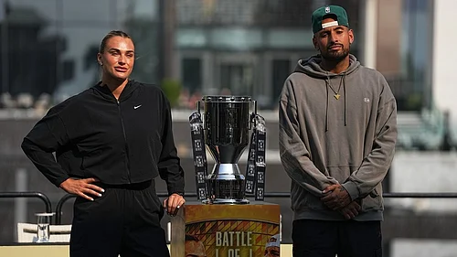 AP : Aryna Sabalenka, left, and Nick Kyrgios pose with the trophy during a press conference ahead of the Battle of the Sexes exhibition match at Atlantis The Royal in Dubai, United Arab Emirates.