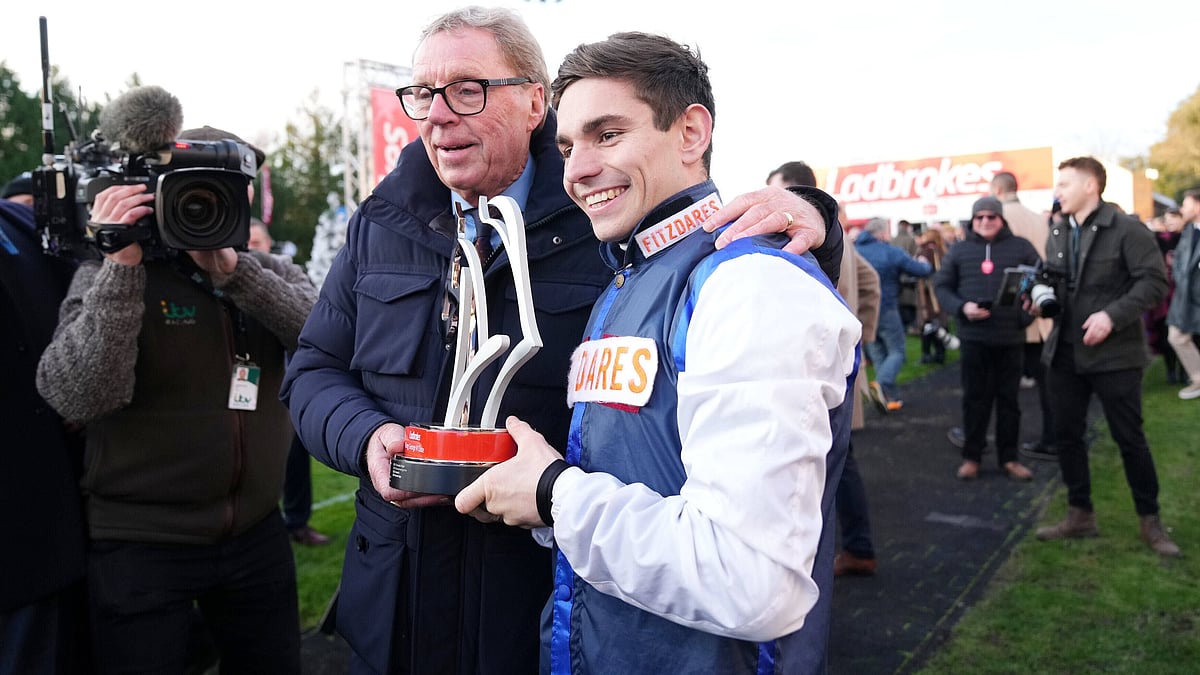 | Photo: PA/John Walton via AP : Ben Jones, right, celebrates with Harry Redknapp after The Jukebox Man wins the Ladbrokes King George VI Chase during day one of the Ladbrokes Christmas Festival at Kempton Park Racecourse, Sunbury-on-Thames, England, Friday Dec. 26, 2025.