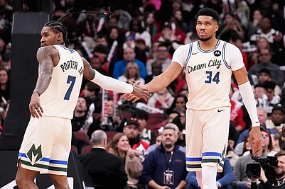 | Photo: AP/Nam Y. Huh : Milwaukee Bucks forward Giannis Antetokounmpo, right, celebrates with guard Kevin Porter Jr.. left, during the second half of an NBA basketball game against the Chicago Bulls in Chicago.