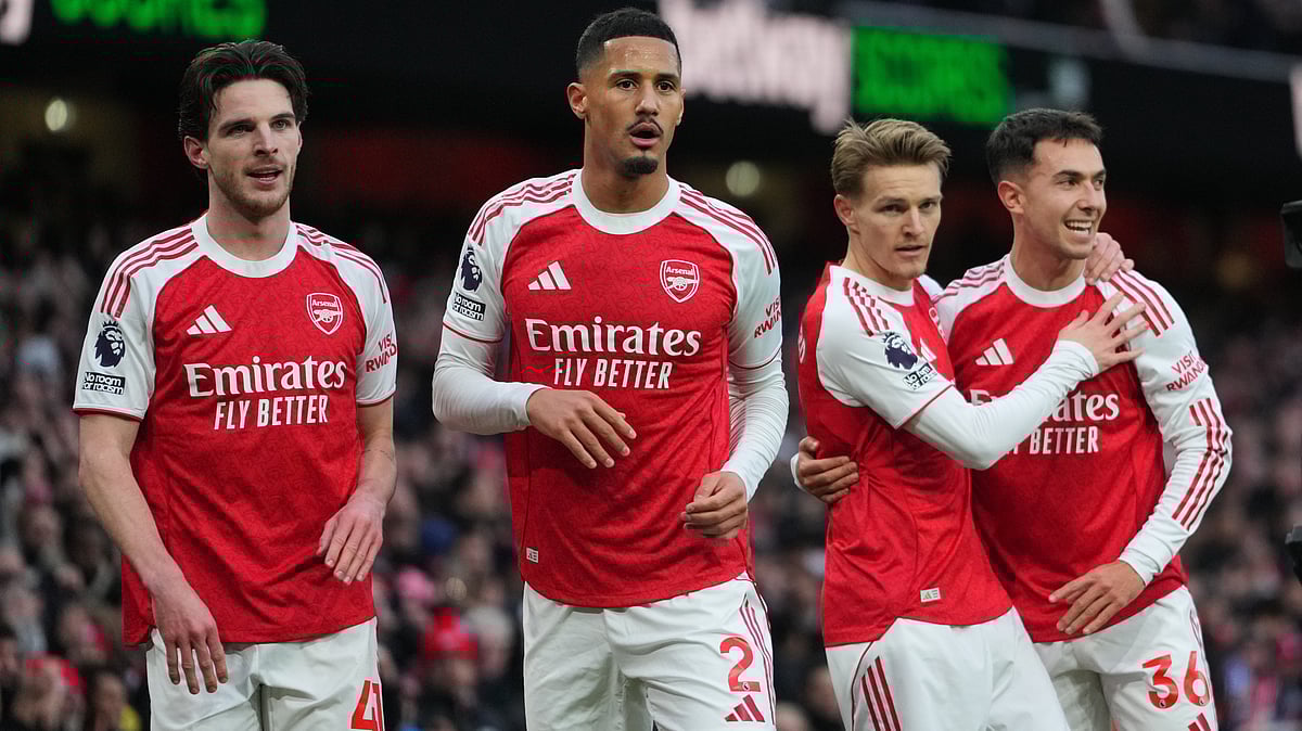 | Photo: AP/Kirsty Wigglesworth : Arsenal's Declan Rice, William Saliba, scorer Martin Odegaard and Martin Zubimendi, from left, celebrate their opening goal during the English Premier League soccer match between Arsenal and Brighton and Hove Albion in London, Saturday, Dec. 27, 2025. 