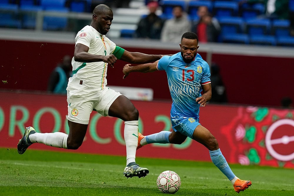 | Photo: AP/Themba Hadebe : DR Congos Meschack Elia and Senegals Kalidou Koulibaly compete for the ball during the Africa Cup of Nations group D soccer match between Senegal and DR Congo in Tangier, Morocco.