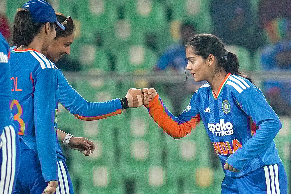 | Photo: PTI : From left, Indias Harleen Deol, captain Harmanpreet Kaur and Vaishnavi Sharma celebrate a wicket during the fourth T20 International cricket match of a series between India Women and Sri Lanka Women, at Greenfield International Stadium, in Thiruvananthapuram, Kerala.