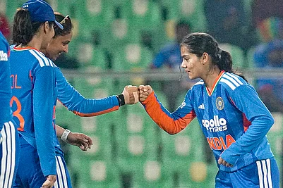| Photo: PTI : From left, Indias Harleen Deol, captain Harmanpreet Kaur and Vaishnavi Sharma celebrate a wicket during the fourth T20 International cricket match of a series between India Women and Sri Lanka Women, at Greenfield International Stadium, in Thiruvananthapuram, Kerala.