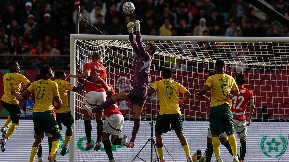 | Photo: AP/Themba Hadebe : Egypt's goalkeeper Mohamed Sobhy clears the ball during the Africa Cup of Nations group B soccer match between Egypt and South Africa in Agadir, Morocco.