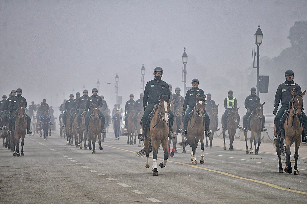 | Photo: PTI : Indian Presidents Bodyguard on horses during rehearsals ahead of Republic Day celebrations at Kartavya path, in New Delhi.