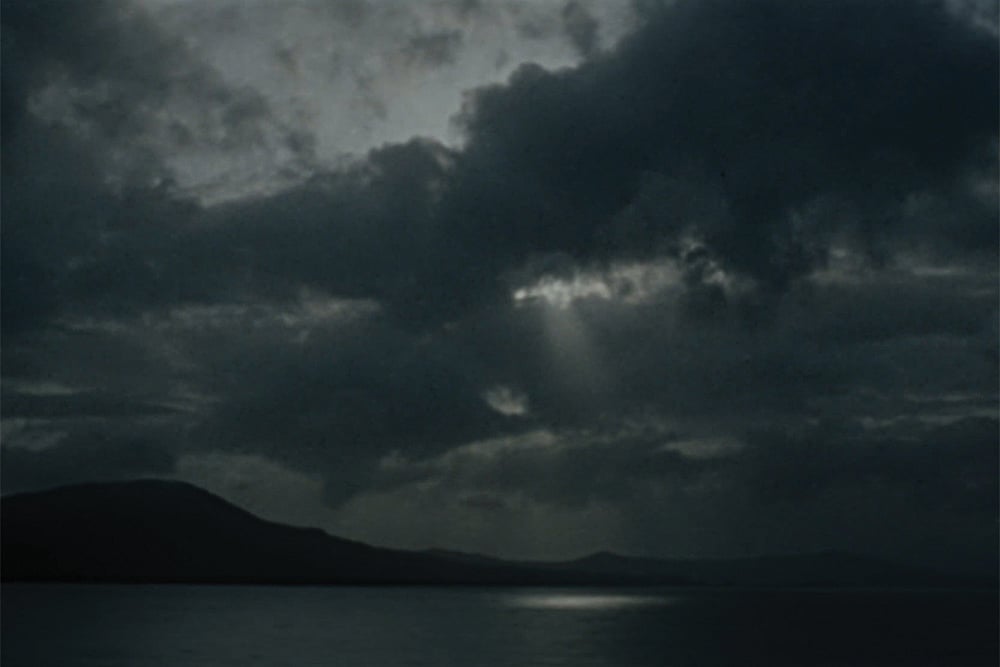 | Stills from the latest film, A Breath Held Long,By Sudarshan Shetty : He walked in the rain with an excuse of a lost umbrella that he once borrowed from his mother as the raindrops poured down his cheeks like exaggerated salty sorrow that slowly pooled in his pockets submerging the cashless leather wallet that made him happy to imagine he was losing a lifetime of fortune to a grand deluge