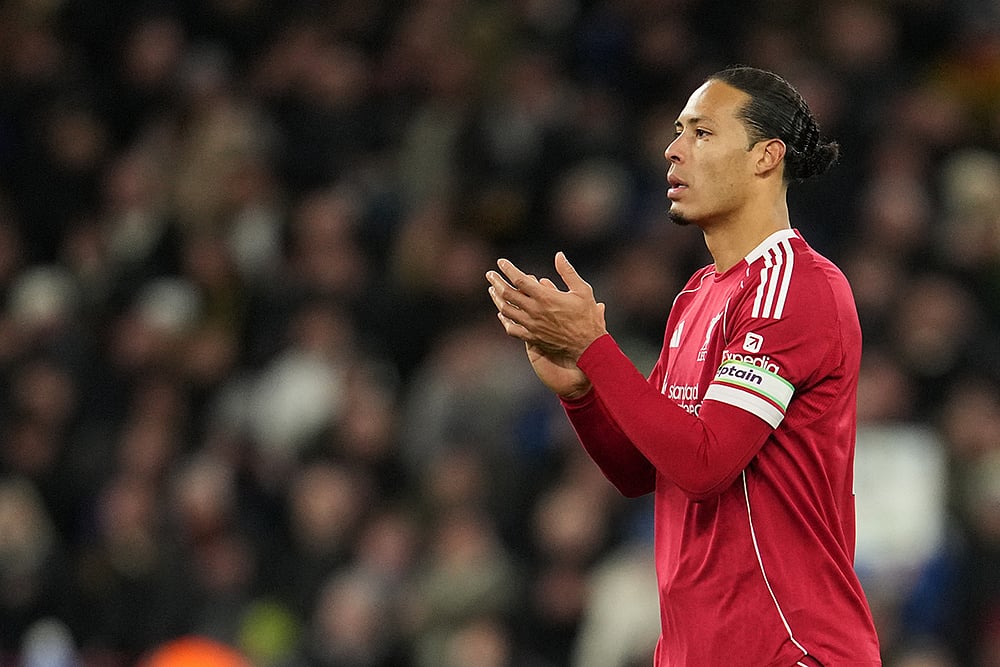 | Photo: AP/Jon Super : Liverpools Virgil van Dijk applauds to supporters at the end of the English Premier League soccer match between Liverpool and Leeds United in Liverpool, England
