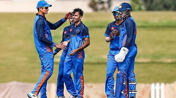 | Photo: PTI/Shailendra Bhojak : Gujarats Ravi Bishnoi, centre, with teammates celebrates after taking the wicket of Delhis Ayush Badoni during the Vijay Hazare Trophy 2025-26 cricket match between Gujarat and Delhi, at BCCI Centre of Excellence Ground, in Bengaluru.