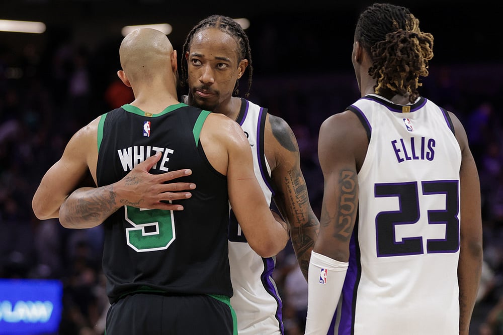 | Photo: AP/Scott Marshall : Boston Celtics guard Derrick White (9) and Sacramento Kings guard Demar Derozan, behind, hug before times runs out during the second half of an NBA basketball game in Sacramento, California. 