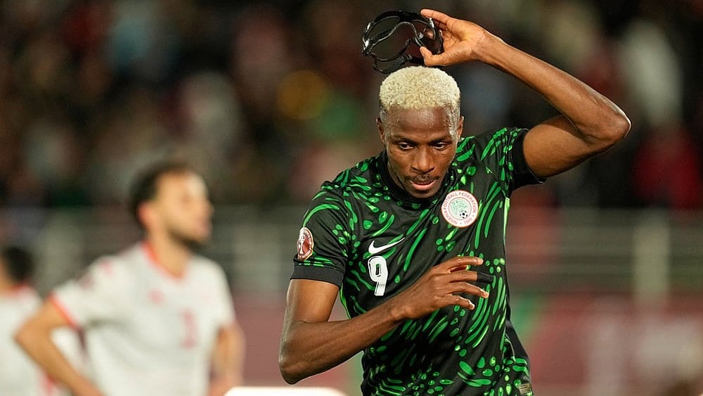 | Photo: AP/Mosa'ab Elshamy : Nigeria's Victor Osimhen reacts after scoring his side's first goal during the Africa Cup of Nations group C soccer match between Nigeria and Tunisia in Fez, Morocco.