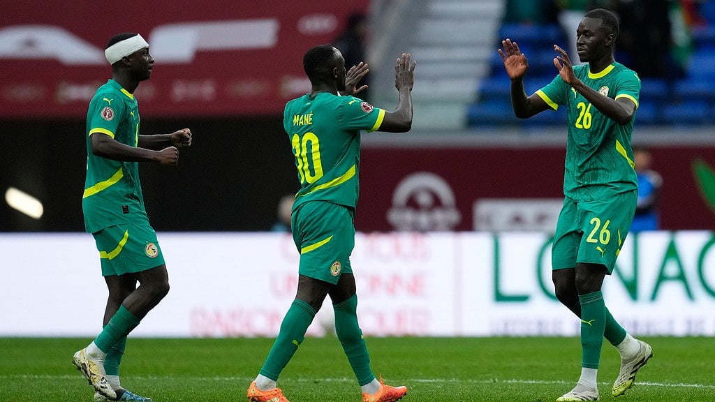 Photo: AP : Senegal's Pape Gueye, right, celebrates with teammates after scoring against Sudan during their Africa Cup of Nations round of 16 match in Tangier, Morocco.