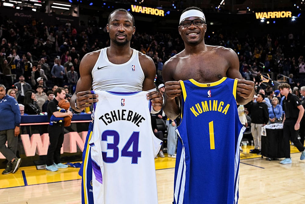 | Photo: AP/Justine Willard : Golden State Warriors forward Jonathan Kuminga (1) and Utah Jazz center Oscar Tshiebwe (34) swap jerseys after the Warriors defeat the Jazz during an NBA basketball game  in San Francisco.