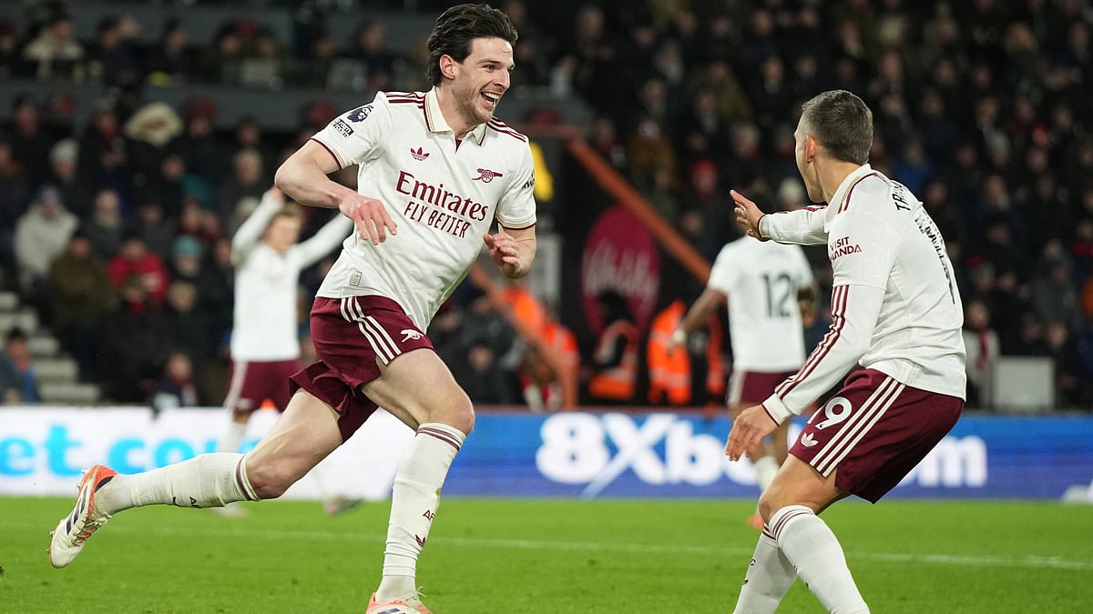 | Photo: AP/Alastair Grant : Arsenal's Declan Rice, left, celebrates with Arsenal's Leandro Trossard after scoring his sides third goal during the English Premier League soccer match between Bournemouth and Arsenal in Bournemouth, England, Saturday, Jan. 3, 2026.