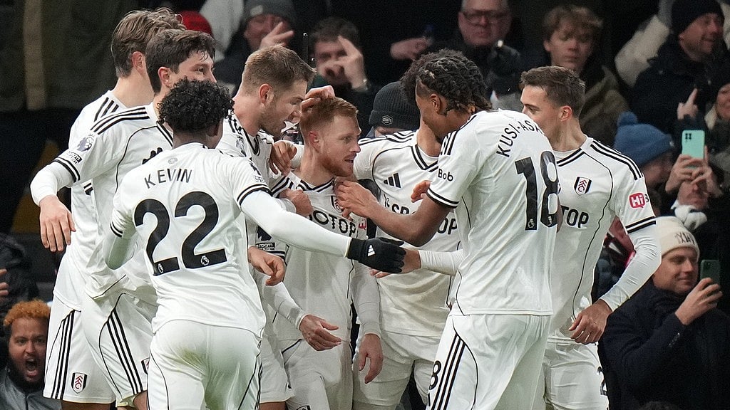 Photo: AP : Fulham's Harrison Reed, centre, celebrates after scoring his side's second goal during the English Premier League match against Liverpool in London.