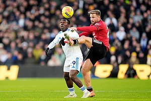 | Photo: Danny Lawson/PA via AP : Leeds United's Wilfried Gnonto, left, and Manchester United's Luke Shaw battle for the ball during the English Premier League soccer match between Leeds United and Manchester United in Leeds, England.