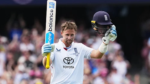 | Photo: AP/Mark Baker : Englands Joe Root celebrates after scoring a century during play on day two of the fifth and final Ashes cricket test between England and Australia in Sydney, Monday, Jan. 5, 2026.