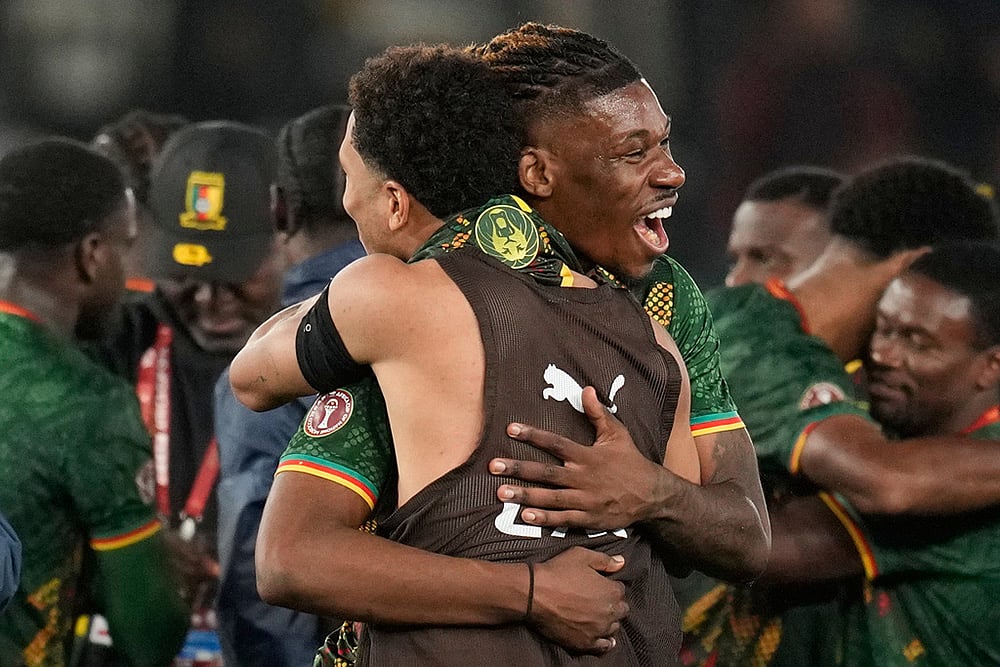 | Photo: AP/Themba Hadebe : Cameroons players celebrate after losing the Africa Cup of Nations round of 16 soccer match between South Africa and Cameroon in Rabat, Morocco.