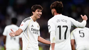 | Photo: AP/Pablo Garcia : Real Madrid's Raul Asencio, right, celebrates with Real Madrid's Gonzalo Garcia after scoring his sides third goal during the Spanish La Liga soccer match between Real Madrid and Real Betis Sevilla in Madrid, Spain, Sunday, Jan. 4, 2026.