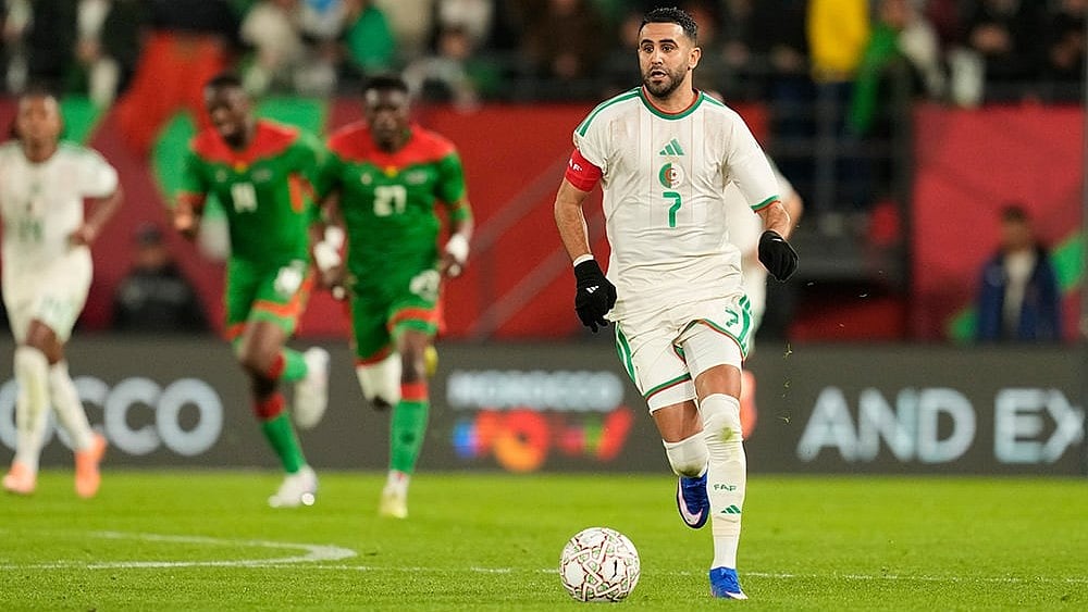 | Photo: AP/Mosa'ab Elshamy : Algeria's Riyad Karim Mahrez controls the ball during the Africa Cup of Nations group E soccer match between Algeria and Burkina Faso in Rabat, Morocco.