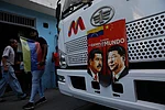 AP Photo/Cristian Hernandez : A banner on the front end of a bus features images of Venezuelan President Nicolas Maduro and Chinas Xi Jinping with a message that reads in Spanish: An example for the world, during a government-organized rally opposing U.S. intervention, in Caracas, Venezuela.