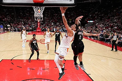 | Photo: AP/David J. Phillip : Phoenix Suns Devin Booker (1) goes up for a shot as Houston Rockets Steven Adams (12) defends during the second half of an NBA basketball game in Houston.