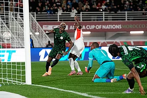| Photo: AP/Themba Hadebe : Nigeria's Victor Osimhen, left, celebrates after scoring his side's third goal during the Africa Cup of Nations round of 16 soccer match between Nigeria and Mozambique in Fez, Morocco.