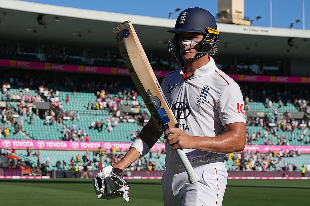 | Photo: AP/Mark Baker : Englands Jacob Bethell walks from the field at the close of play during on day four of the fifth and final Ashes cricket test between England and Australia in Sydney.