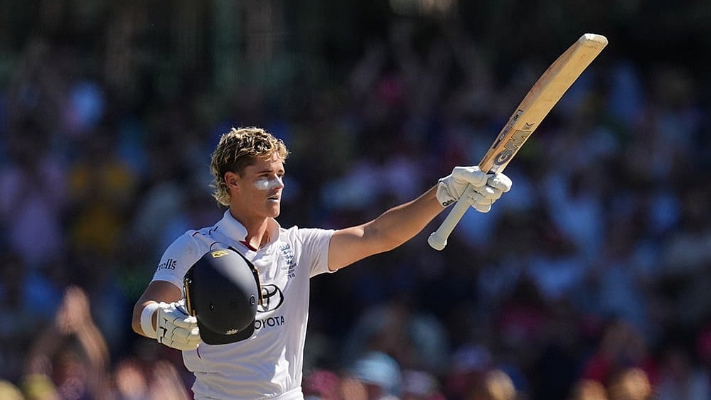 | Photo: AP/Mark Baker : Englands Jacob Bethell celebrates after scoring a century during play on day four of the fifth and final Ashes cricket test between England and Australia in Sydney.