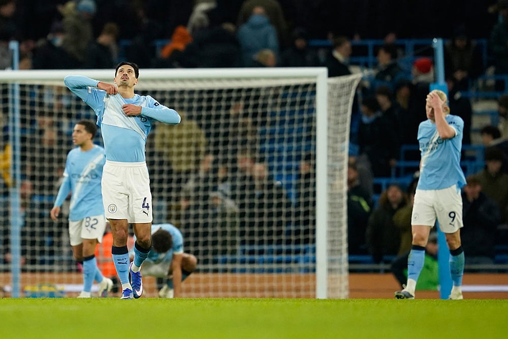 | Photo: AP/Dave Thompson : Manchester Citys Tijjani Reijnders, left, and Manchester Citys Erling Haaland react at the end of the English Premier League soccer match between Manchester City and Brighton and Hove Albion in Manchester, England.
