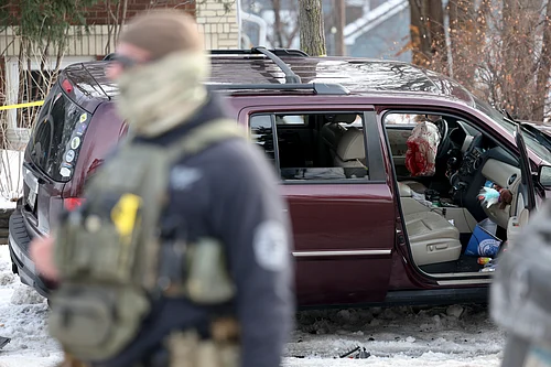 Ellen Schmidt : A deployed airbag and blood stains are seen in a crashed vehicle on at the scene of a shooting in Minneapolis on Wednesday, Jan. 7, 2026.