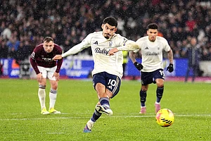 | Photo: John Walton/PA via AP : Nottingham Forest's Morgan Gibbs-White scores his side's second goal during the English Premier League soccer match between West Ham United and Nottingham Forest in London.