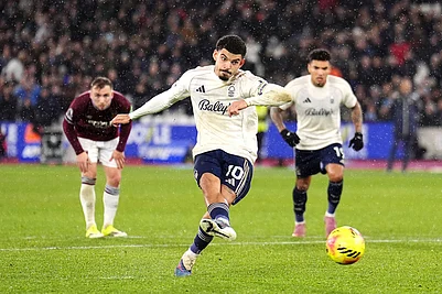 | Photo: John Walton/PA via AP : Nottingham Forests Morgan Gibbs-White scores his sides second goal during the English Premier League soccer match between West Ham United and Nottingham Forest in London.