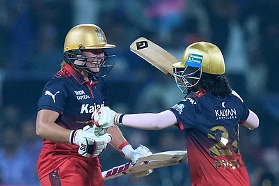 | Photo: PTI/Kunal Patil : Royal Challengers Bengaluru’s Nadine de Klerk and Prema Rawat celebrate after winning the Womens Premier League (WPL) T20 cricket match between Mumbai Indians and Royal Challengers Bengaluru, at the DY Patil Stadium, in Navi Mumbai,
