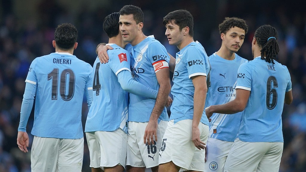 Photo: AP : Manchester City players celebrate after a goal during the FA Cup third-round match against Exeter City in Manchester.