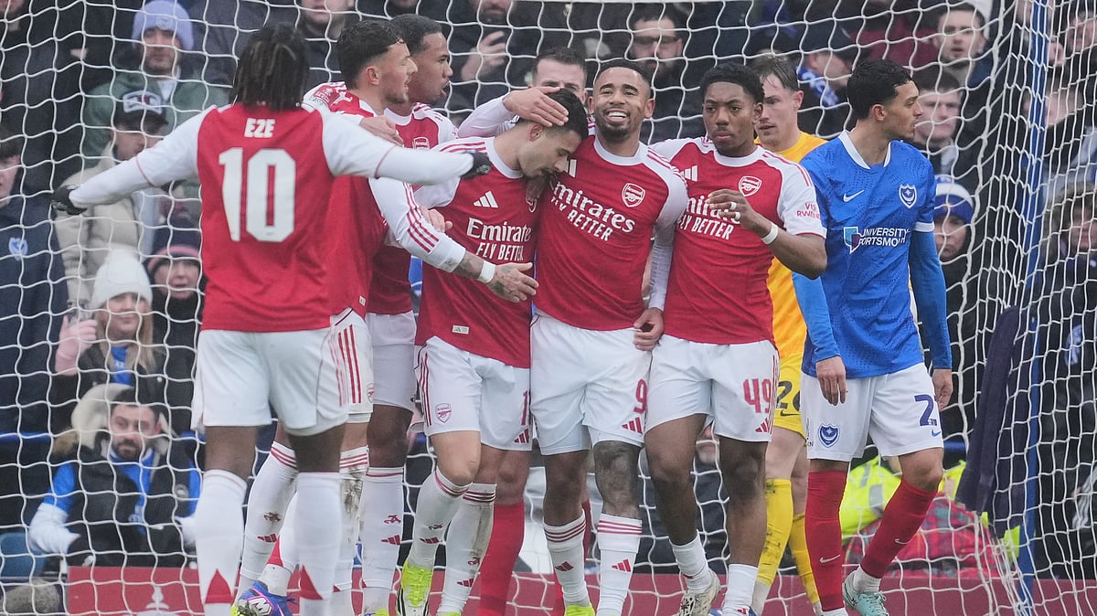 AP/Kin Cheung : Arsenal players celebrate after a goal during the FA Cup third round soccer match between Portsmouth and Arsenal in Portsmouth.