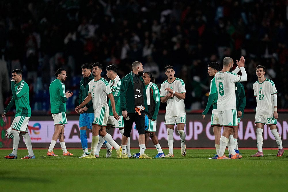 | Photo: AP/Themba Hadebe : Algerias players leave the field following the Africa Cup of Nations quarterfinal soccer match between Algeria and Nigeria in Marrakech, Morocco.